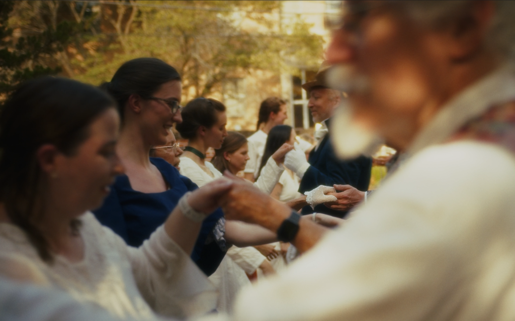 This is a photo of a group of people English Country Dancing at the 2024 French Heritage Festival.