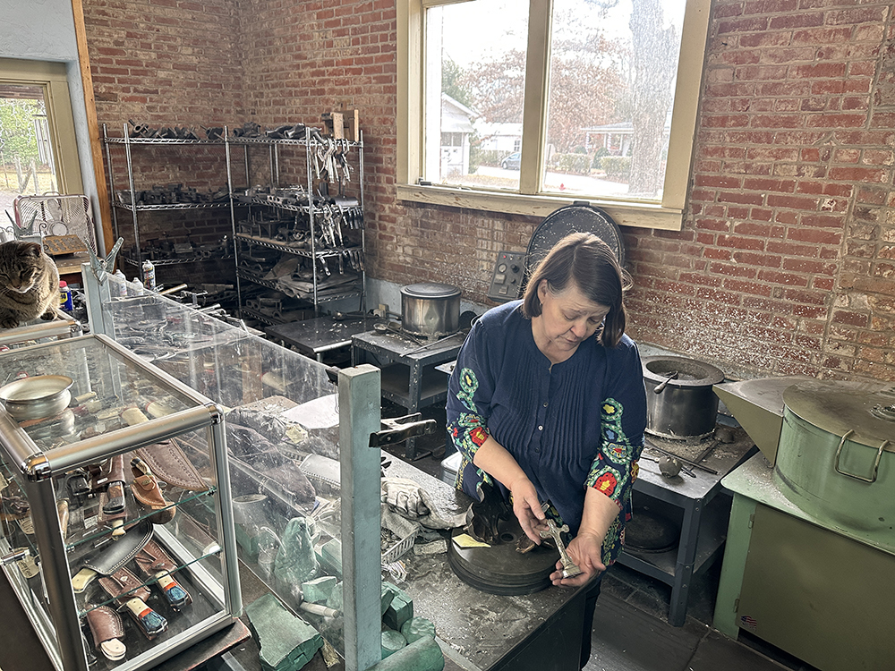 IMG_3248 This is a photo of Pat Hooper showing off her pewter-making skills at ASL Pewter in downtown Ste. Genevieve, MO.